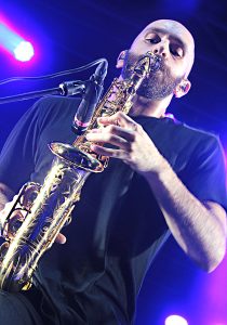 Lead vocalist, guitarist, and saxman, Sam Harris.